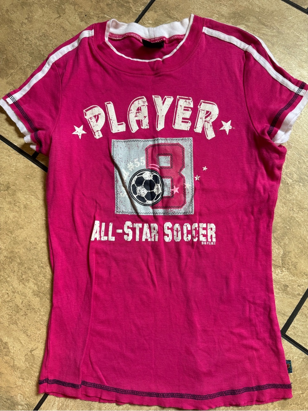 hot pink Y2K-style athletic graphic t-shirt